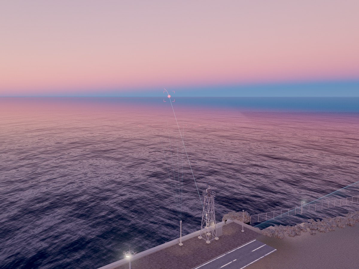 Simulated scene at dusk over the sea from above the quay: the radar tower, and the red track of a small drone coming in.